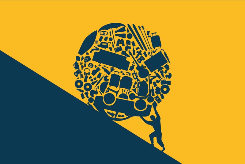 As in the myth of Sisyphus, a man pushes a large ball of non-essential objects on an upward slope.